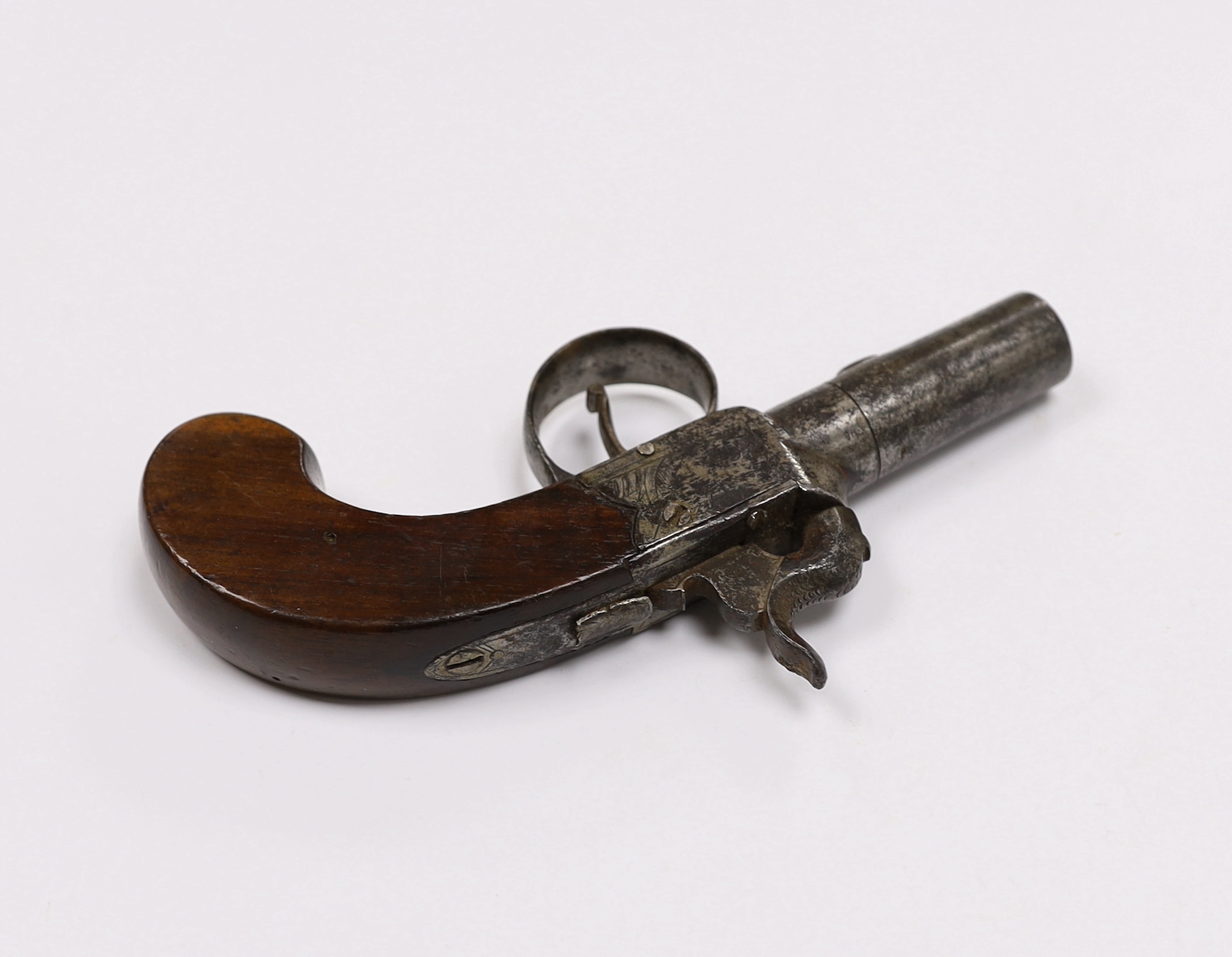 A 19th century box lock percussion pocket pistol with turn off barrel, engraved frame slab and walnut grip, barrel 4.2cm